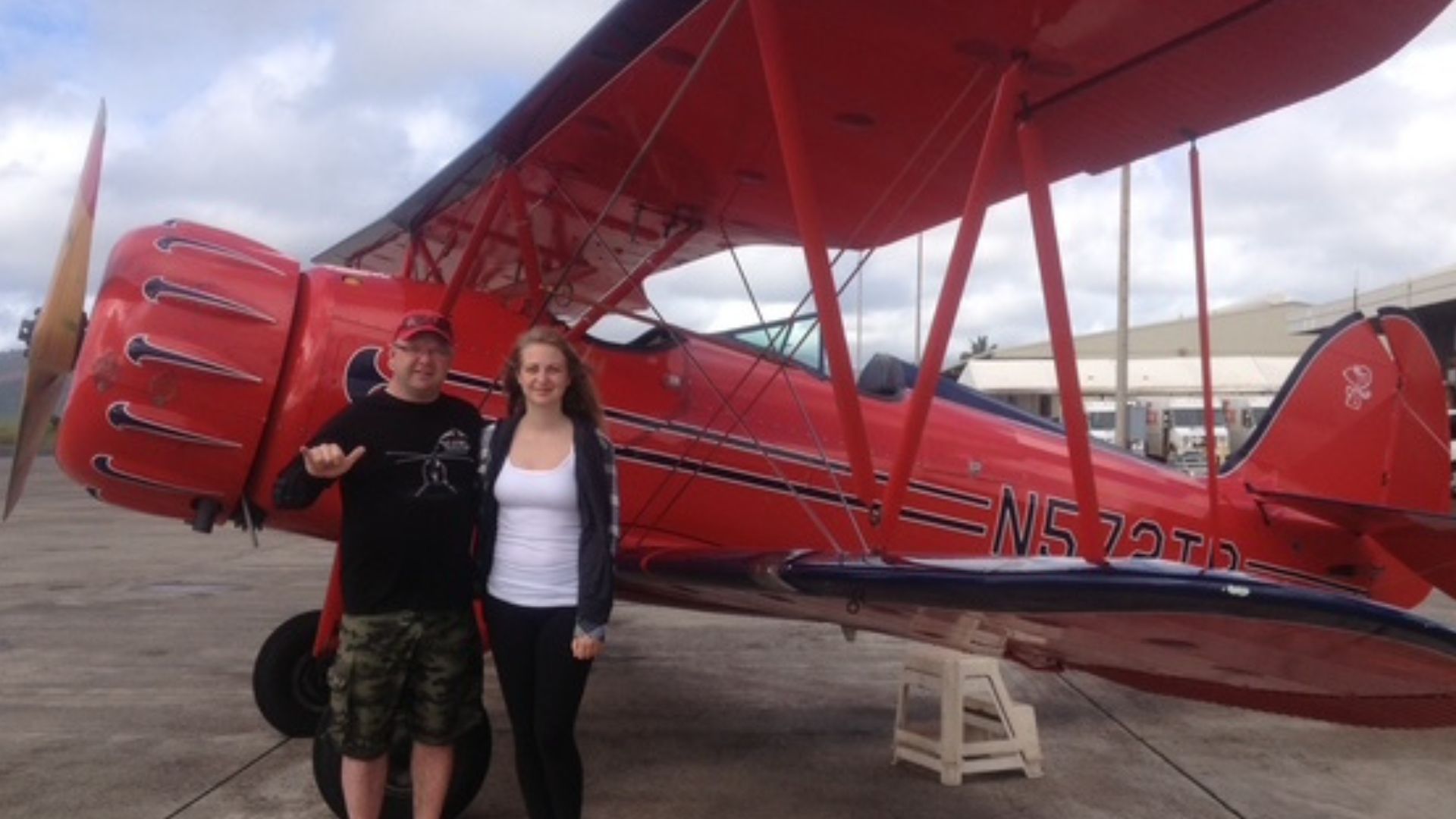 The Hamm family standing together by a plane, sharing Warren's love of aviation